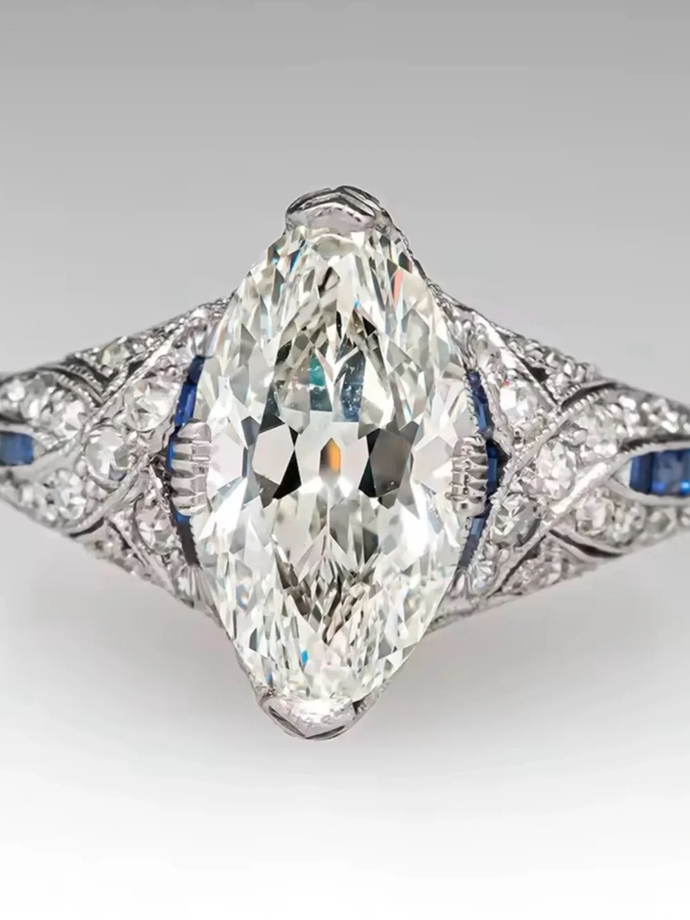 Vintage-Style White Diamond Navette Ring with Blue Accents